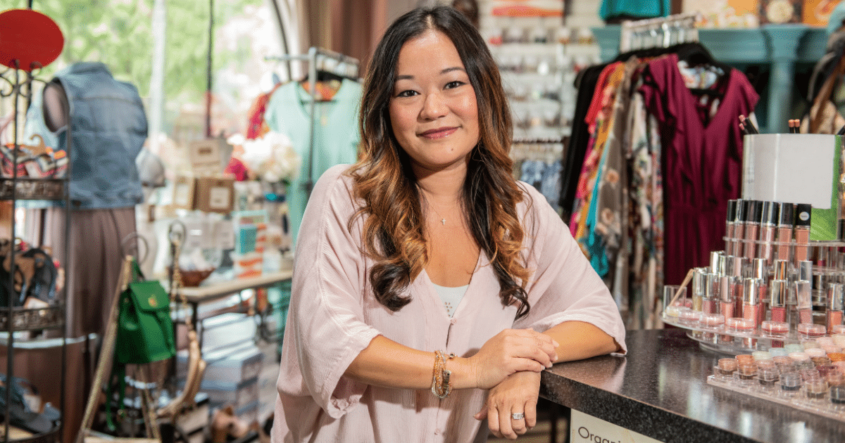 Business owner in a retail store promoting unsecured line of credit benefits for maximizing ROI.