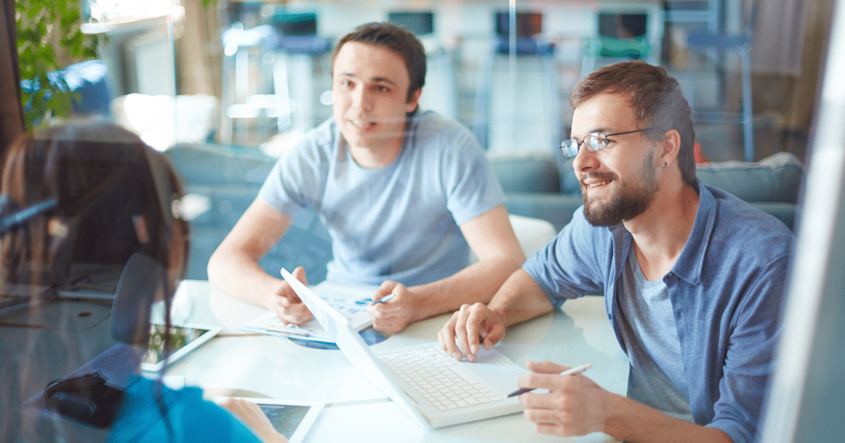 Business professionals discussing financing options for small businesses, comparing AFN Loans and PayPal Working Capital.