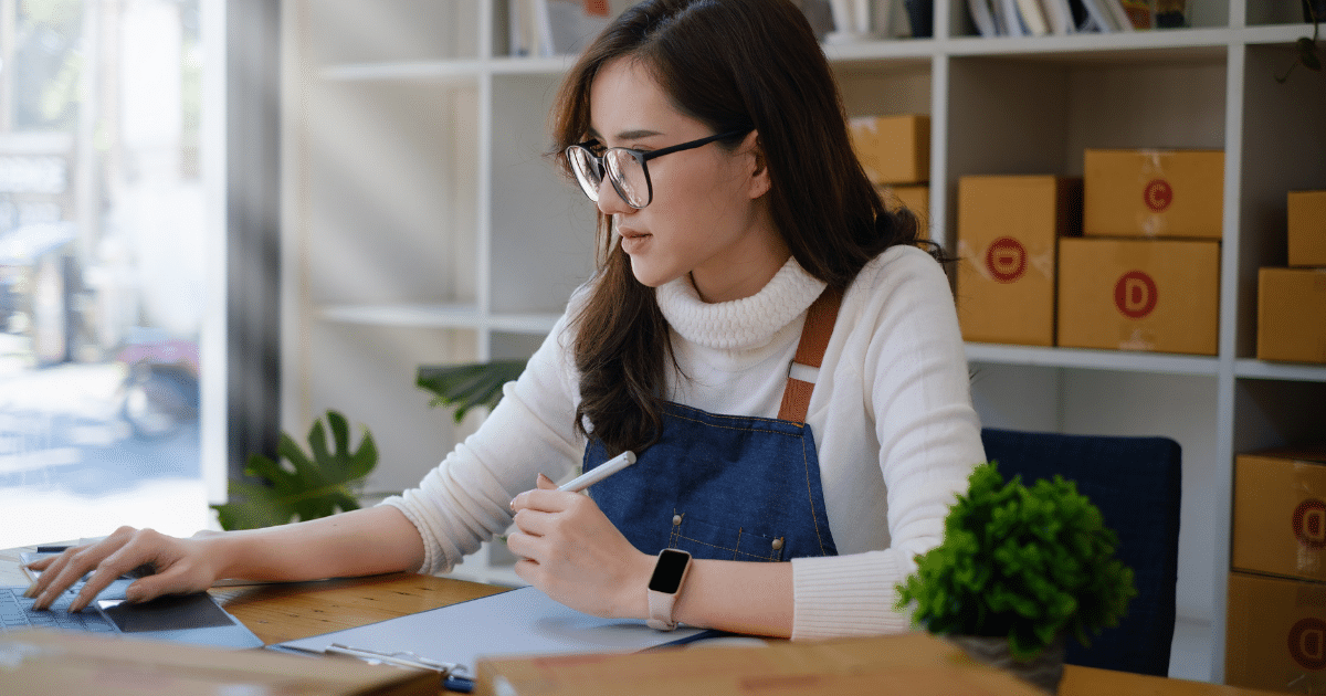 Business owner managing finances with accounts receivable financing for improved cash flow and efficiency.