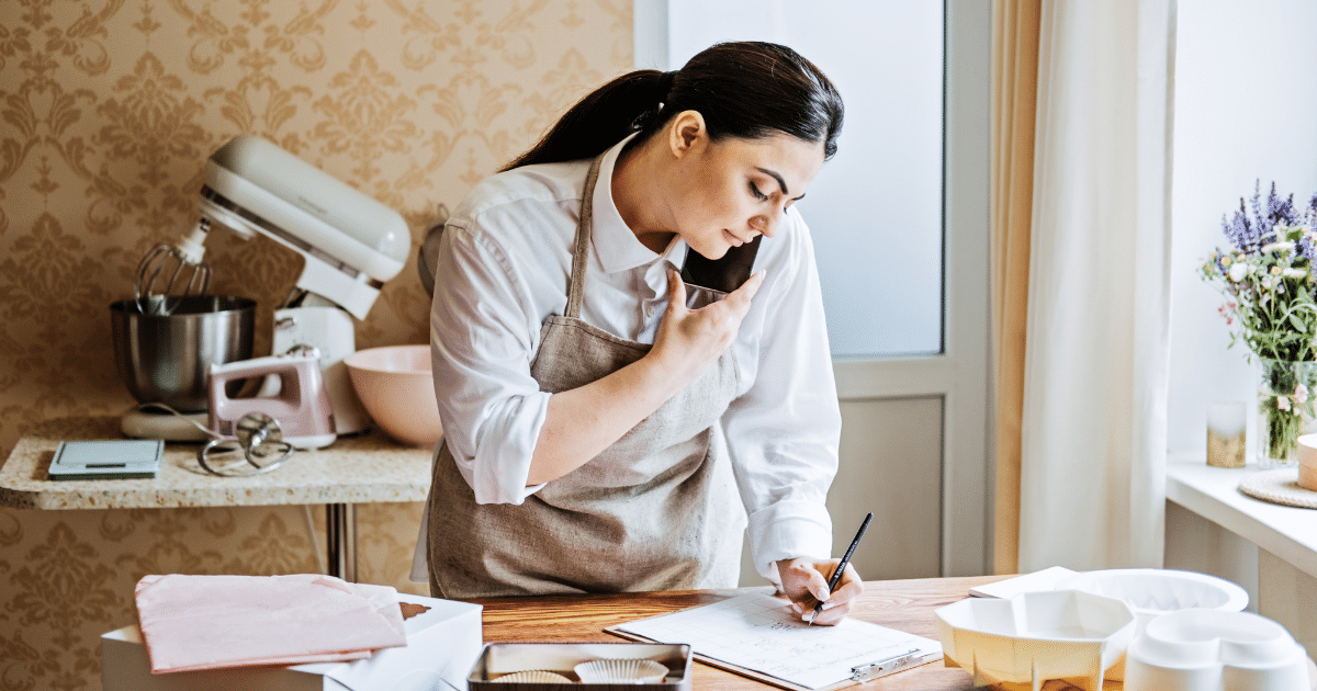 Small business owner using PR strategies to enhance brand awareness and growth in a kitchen setting.