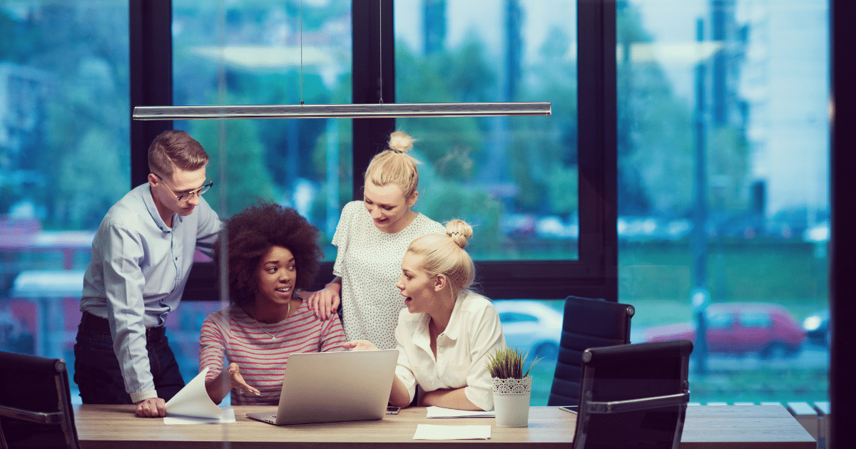 Team collaborating on small business fraud prevention strategies in a modern office setting.