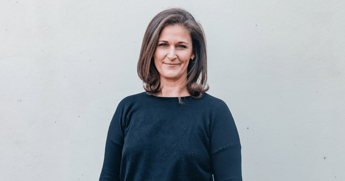 Businesswoman promoting the importance of credit cards for small business success and financial growth.