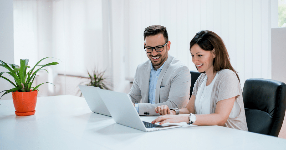 Business professionals collaborating on YouTube strategies for small business growth and success in a modern office setting.