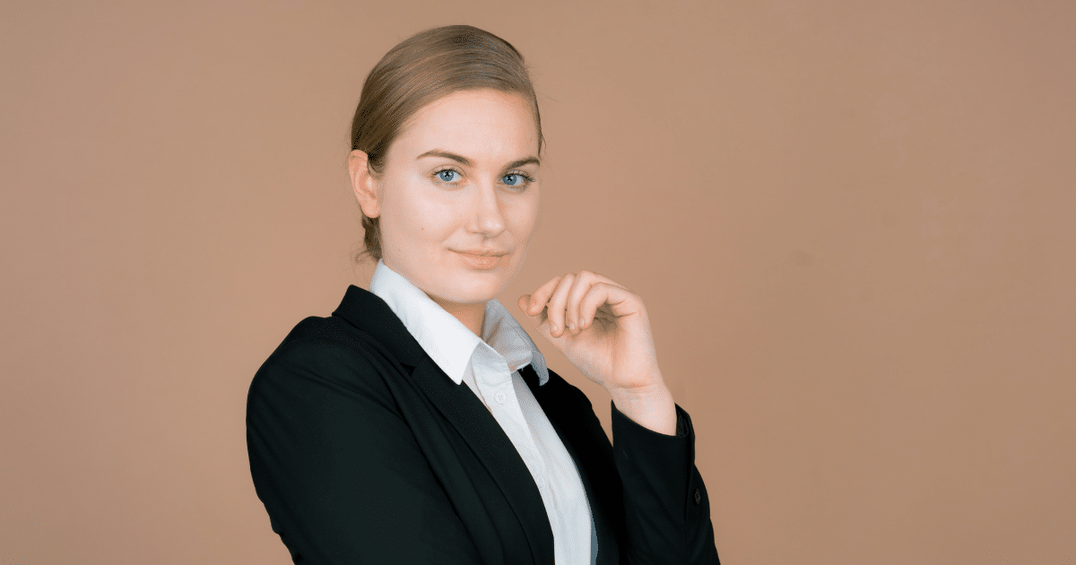 Professional woman in business attire promoting customer satisfaction for business growth and financial success.