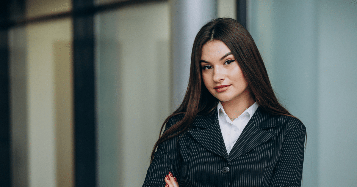 Business professional in a pinstripe suit, representing effective summer sales strategies and customer engagement.