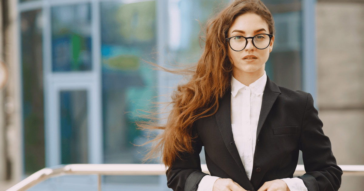 Business professional with long hair in a suit, representing strategies to rebuild bad business credit.