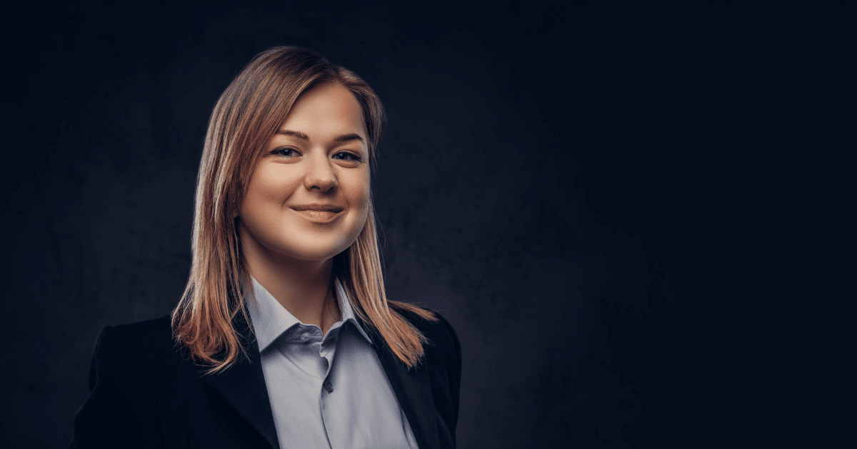 Professional woman smiling, representing small business funding solutions and financial growth opportunities.