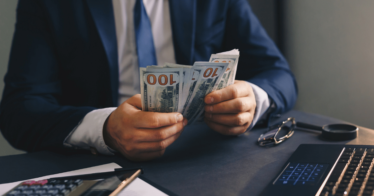 Businessman counting cash for working capital loans to support small business growth and financial stability.