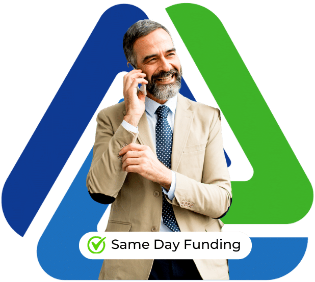 Business professional smiling on the phone, promoting same day funding for business loans.