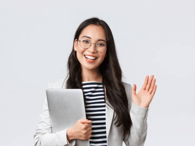 Smiling businesswoman with a laptop, representing financial success and smart business management strategies.