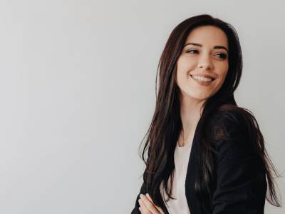 Smiling business owners in a cafe, showcasing flexible business line of credit for finished merchandise financing.