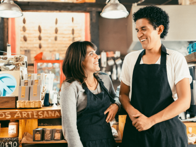 Employees enjoying a positive work environment, highlighting teamwork and employee morale in a small business setting.