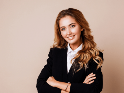 Professional woman smiling in a business suit, representing eCommerce payment gateway solutions for online stores.