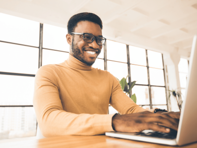 Smiling business owners reviewing financing options for bad credit business loans in California.