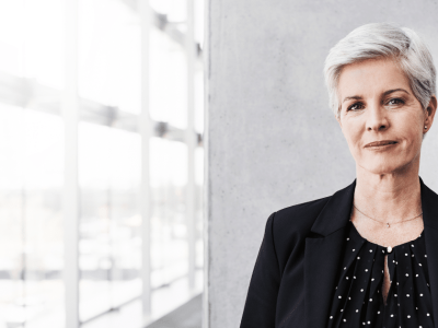 Two businesswomen discussing innovative cash advance solutions in a modern office setting.