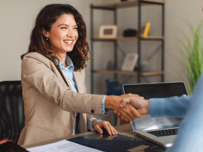 Business professional shaking hands, symbolizing partnership and funding solutions at Advance Funds Network.