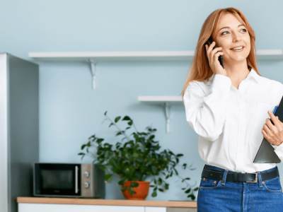 Businesswoman discussing unsecured loans on the phone in a modern office setting, emphasizing safe lending practices.