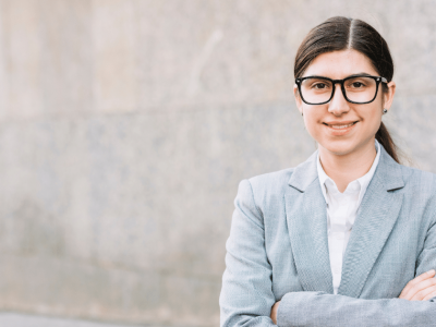 Business professional in a suit, showcasing confidence and leadership in a modern corporate environment.