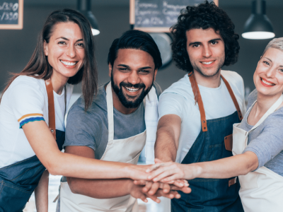 Smiling woman holding a notepad and pen, representing franchise growth and unsecured loans for bad credit.