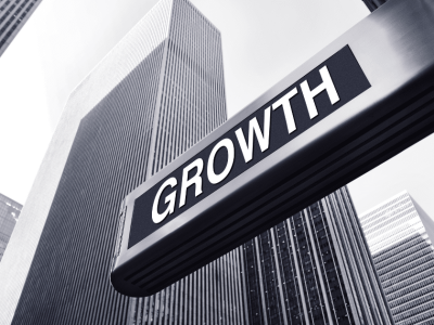 Business growth strategies in a cityscape, emphasizing expansion and financial success after securing funding.