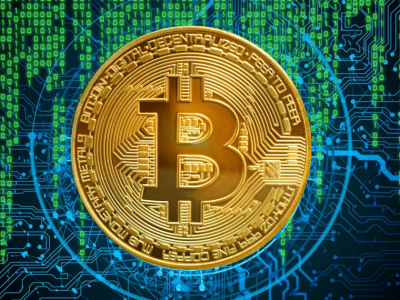 Bitcoin cryptocurrency coin on a digital circuit background, representing Bitcoin basics and mining processes.